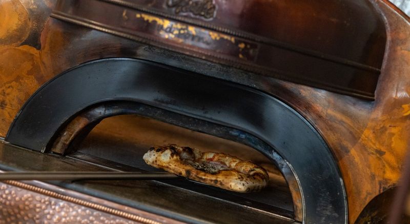 Neapolitan pizza in the copper oven